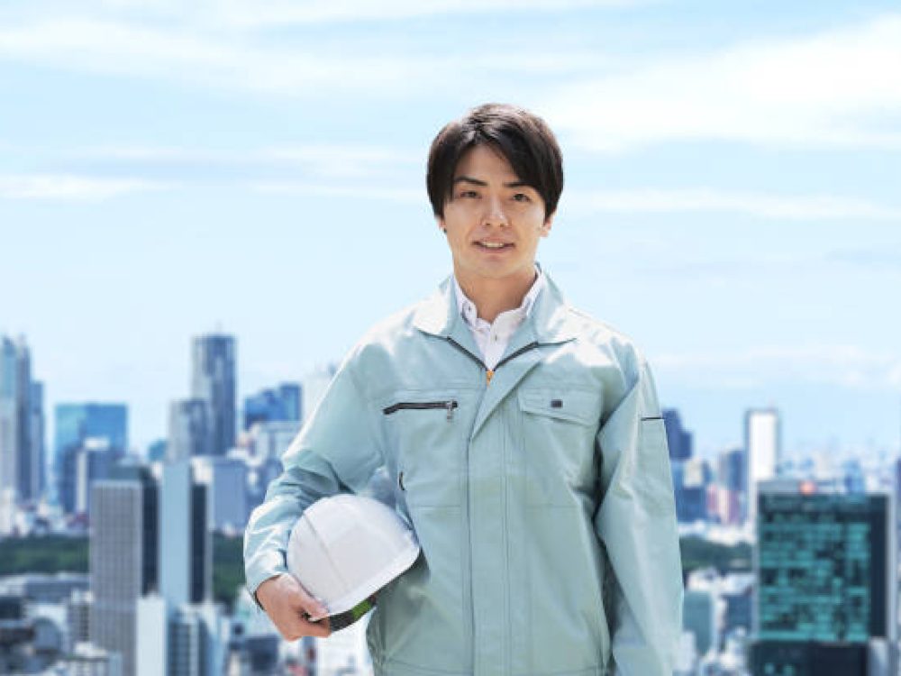 Construction workers against the backdrop of the city